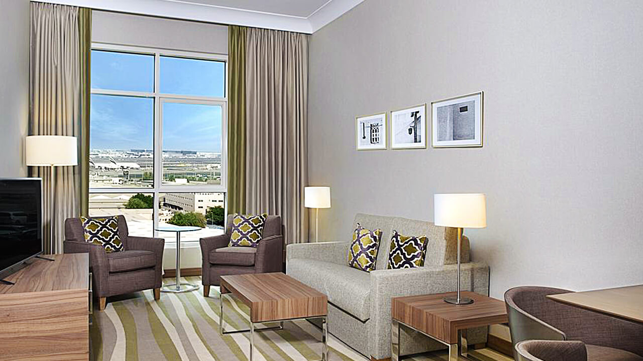 King Suite Living Area with Airport View